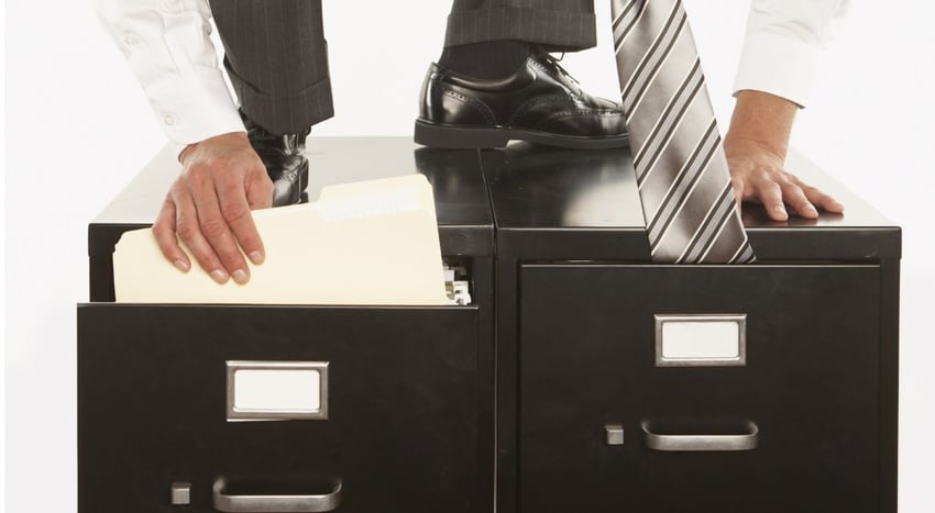 office worker ninja tie in file cabinet